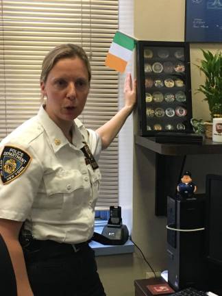 Deputy Inspector Kathleen Walsh with her collection of challenge coins. Photo: Straus News